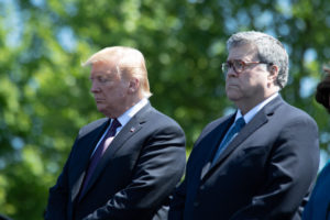Photo of a hunched over Donald Trump standing next to Bill Barr