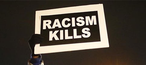 black background with large letters saying Racism Kills