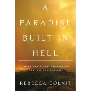 Photo of the book cover for A Paradise Built in Hell by Rebecca Solnit. Cover has a gradient yellow background.