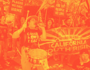 Foreground, woman with drum and microphone, wearing Green New Deal t-shirt. Next to and behind her, people singing. Banner reading "Generation of Fire: California Youth Rising."