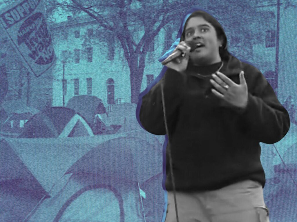 Black-and-white cutout of a person speaking into a microphone, on a blue duotone photo of a tent encampment in front of an old stone building.