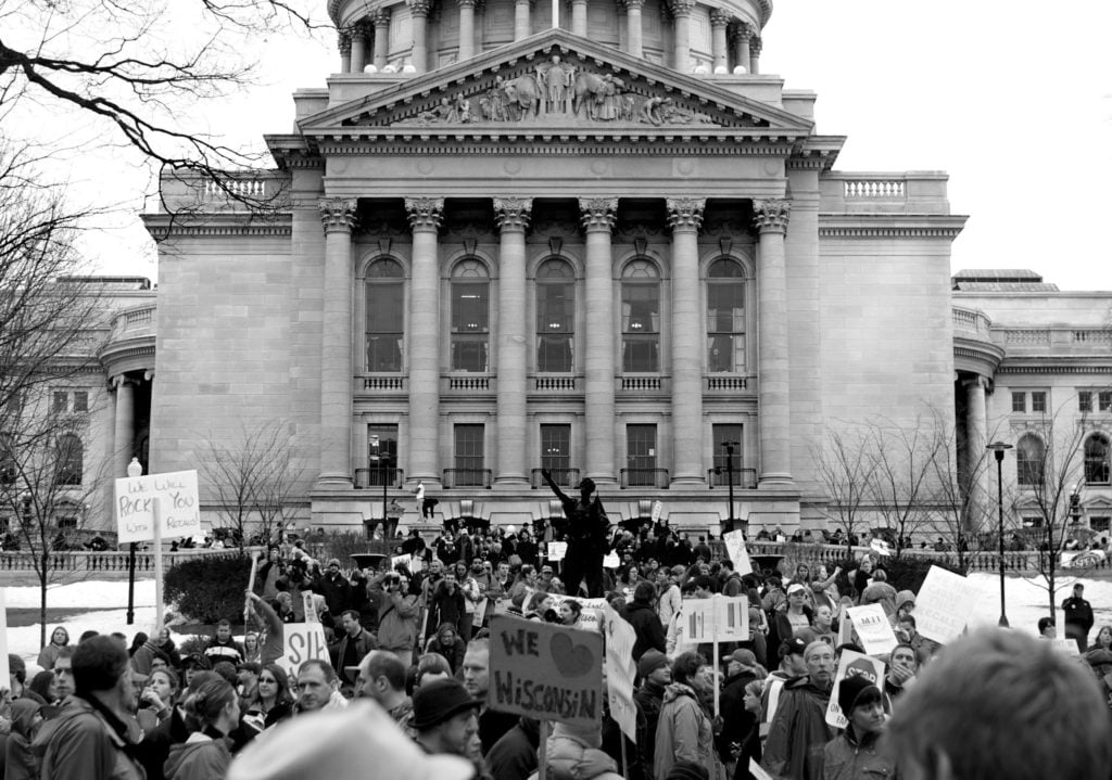 Black and white photo of protestors outside the Wisconsin State Capitol