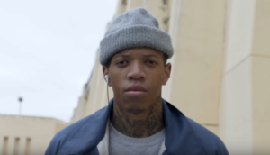 Photo of a black man wearing a knitted head covering