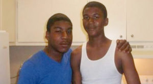 Photograph of Trayvon Martin, a young black man, with another unnamed black man