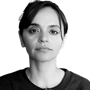 Black and white headshot of Lara Kiswani