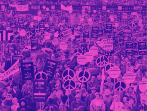 Huge crowd of people, big peace signs visible throughout.