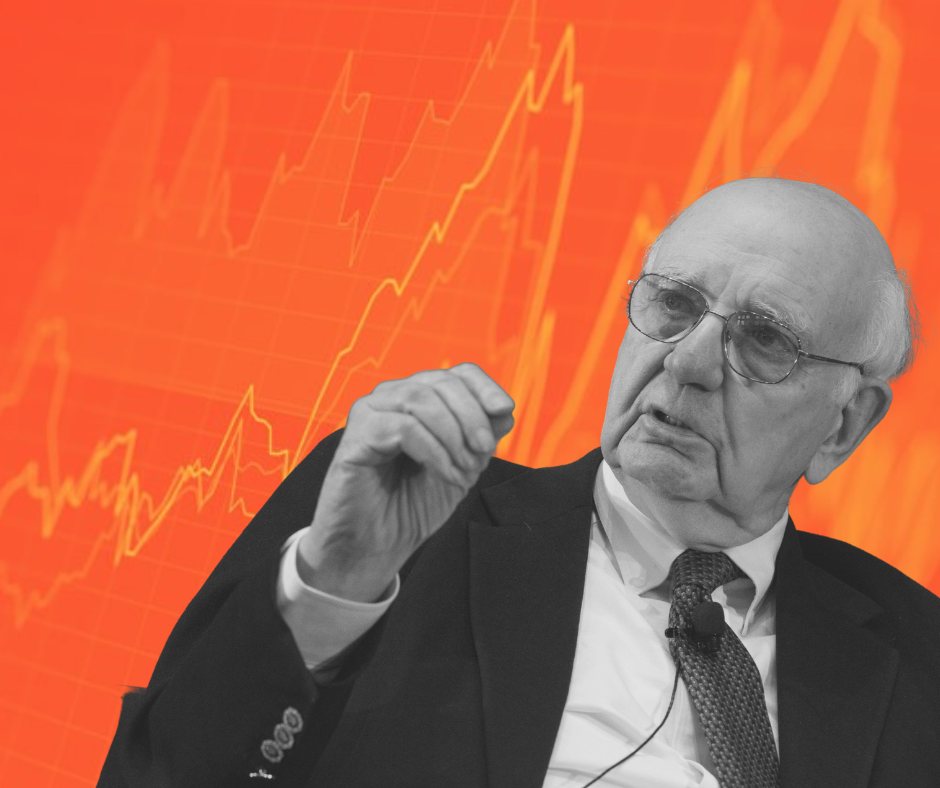 A black and white image of Paul Volcker edited over an orange and yellow swiftly increasing line graph.